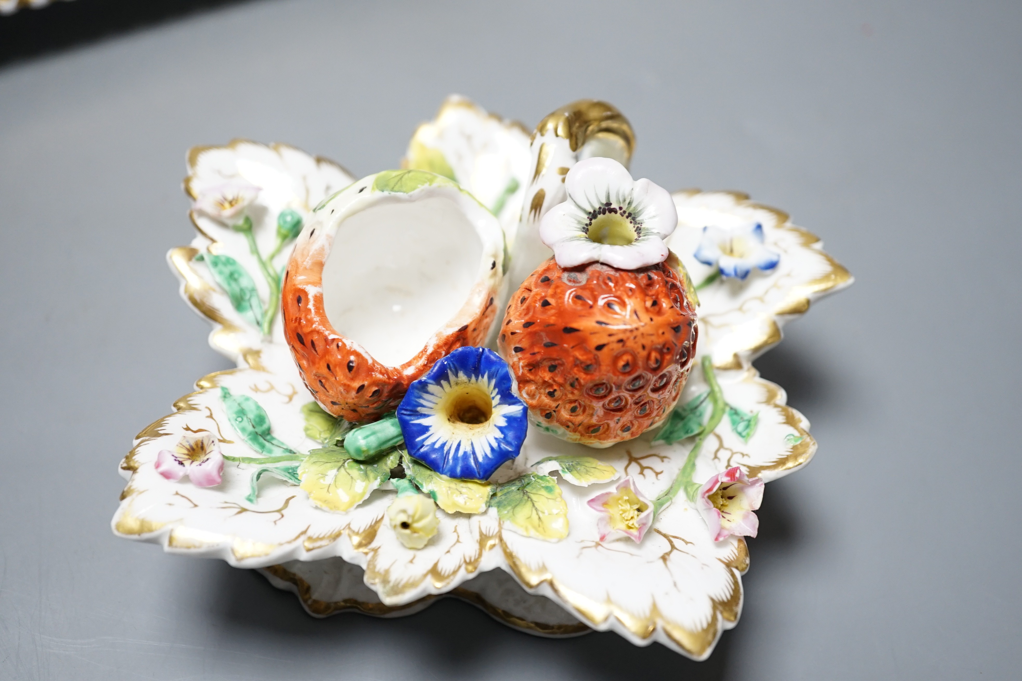 A 19th century Chamberlain Worcester inkstand painted with roses and heatsease, script mark, and a 19th century English porcelain leaf shaped inkwell with strawberry shaped wells, encrusted with flowers picked out in gil